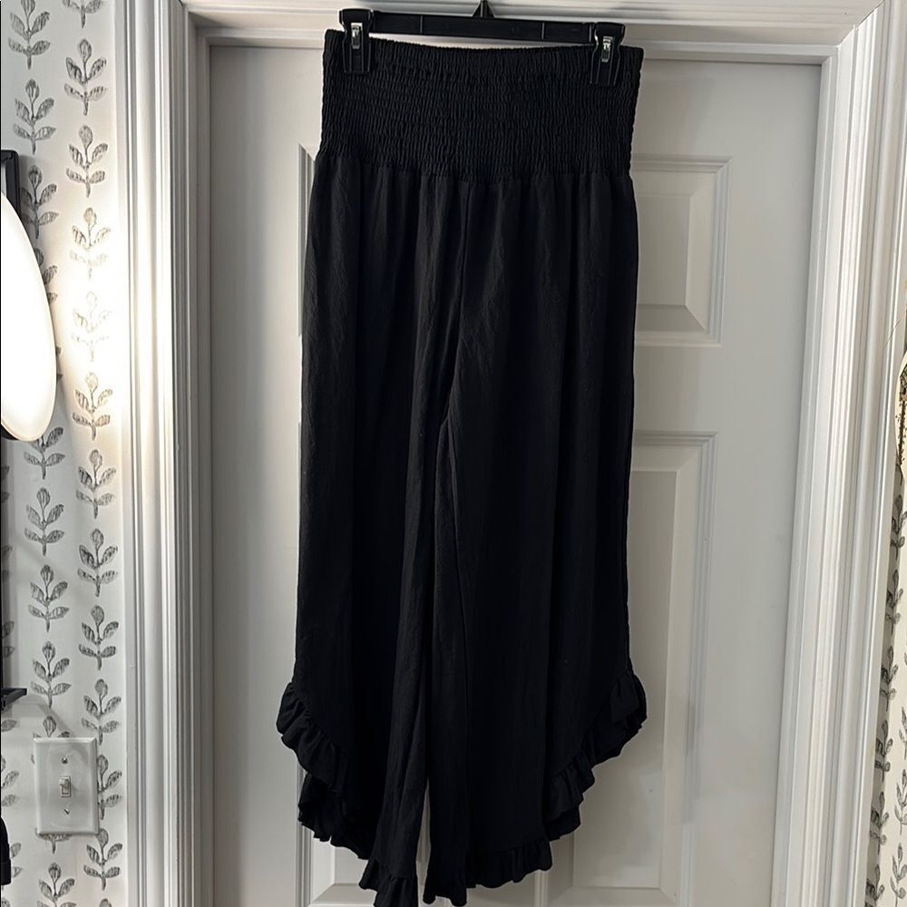 Black Ruffle Hem Wide-Leg Gaucho Pants.  Elastic waist and ruffle hemline